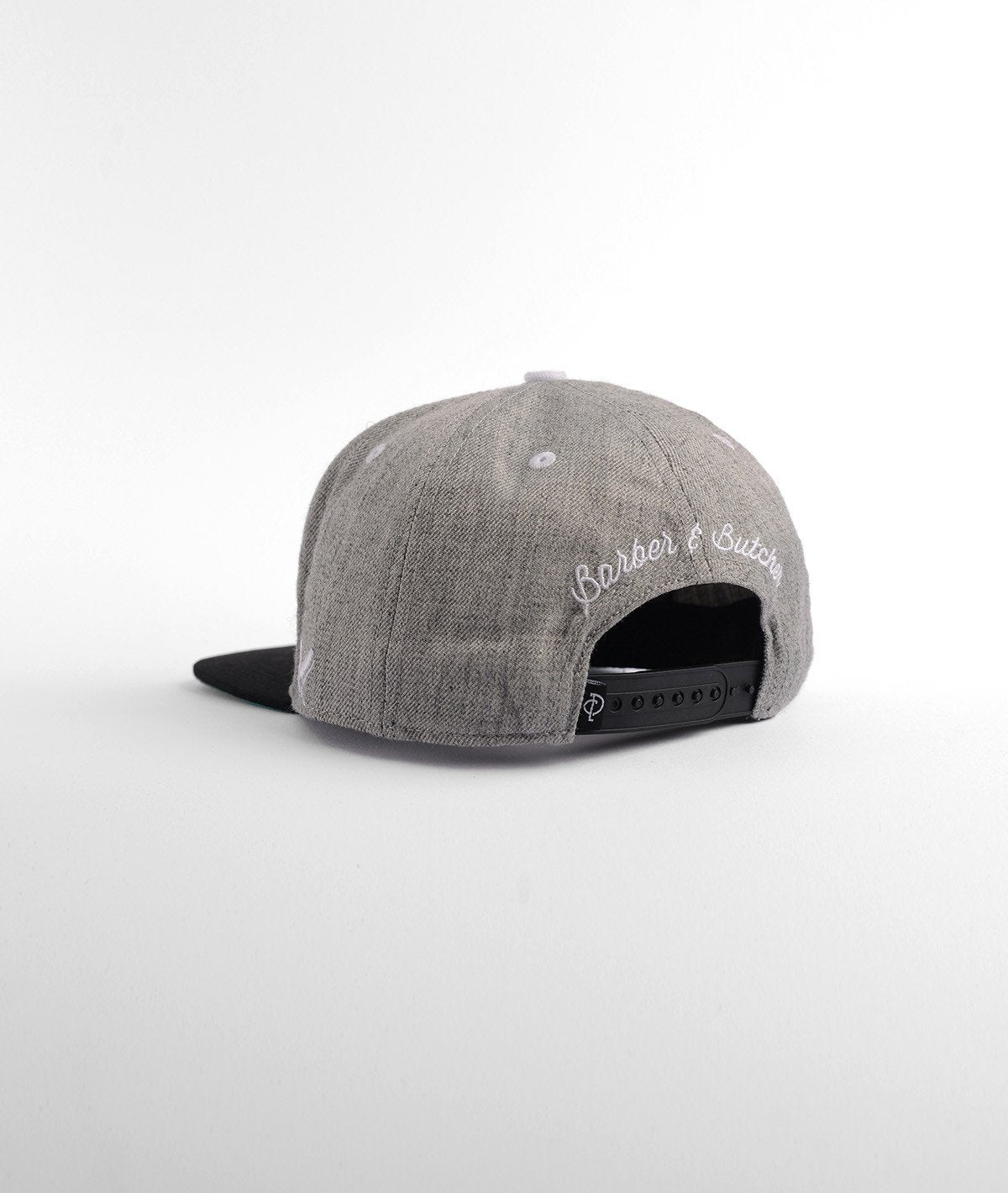 BARBER & BUTCHER snapback cap by Distorted People